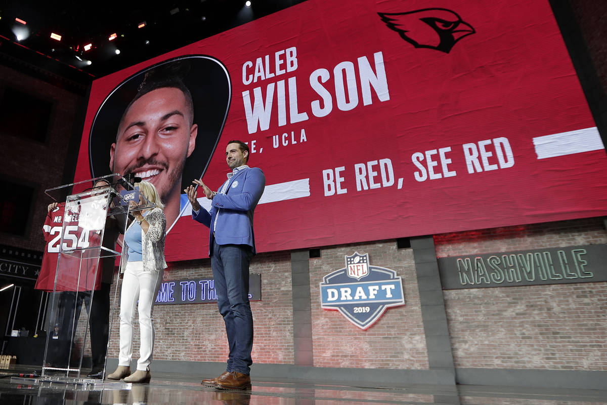 Tennessee Titans kicker Ryan Succop, right, announces the final pick of the NFL football draft ...