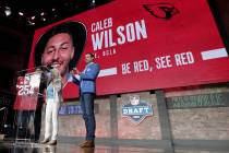 Tennessee Titans kicker Ryan Succop, right, announces the final pick of the NFL football draft ...