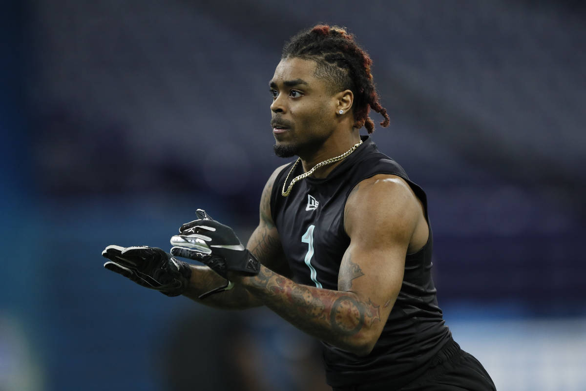 Ohio State defensive back Damon Arnette runs a drill at the NFL football scouting combine in In ...