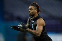Ohio State defensive back Damon Arnette runs a drill at the NFL football scouting combine in In ...