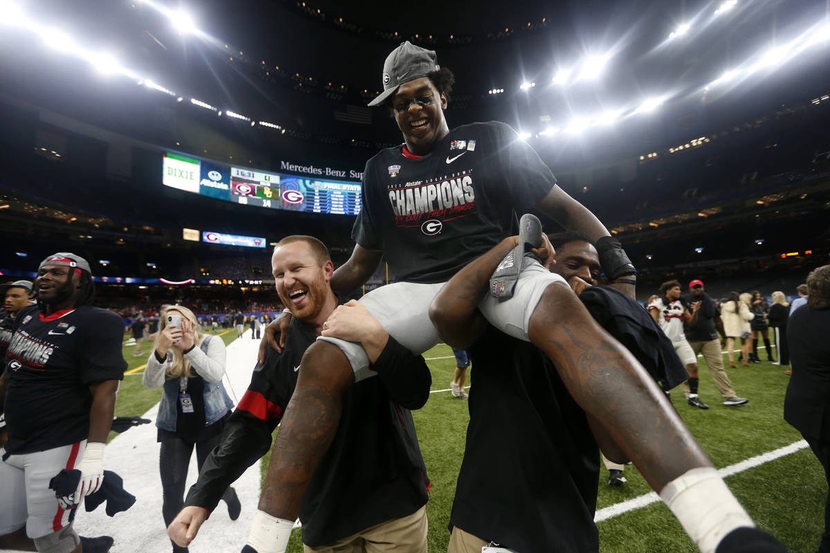 Georgia linebacker Tae Crowder is hoisted in the air after the Sugar Bowl NCAA college football ...
