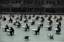 Applicants sit for the written examination during an insurance planner qualification exam in Se ...