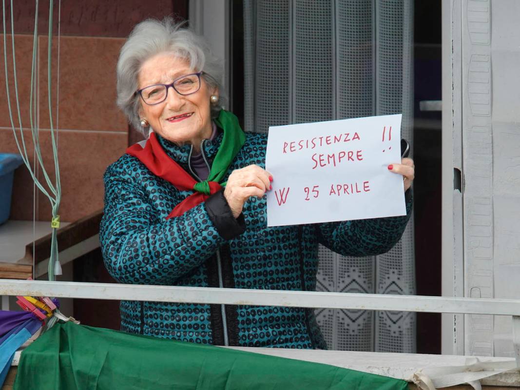 Former partisan Teresa Vergalli, 93, nicknamed Annuska, holds a note reading in Italian "R ...