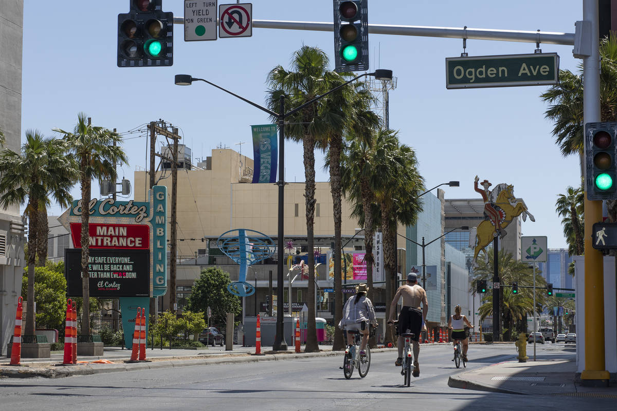 Bikers make way through an empty downtown on Saturday, April 25, 2020, in Las Vegas. (Ellen Sch ...