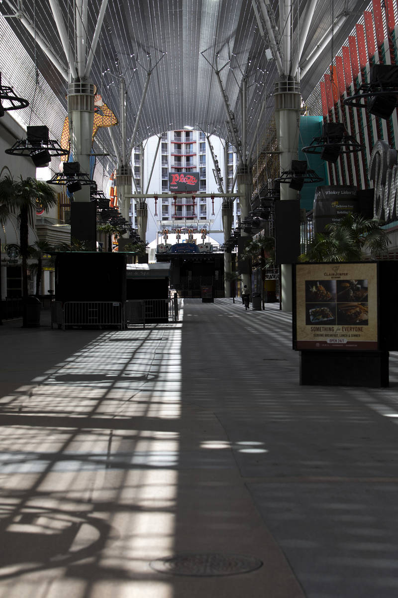 The Fremont Street Experience is vacant on a weekend that would have brought heavy business fro ...