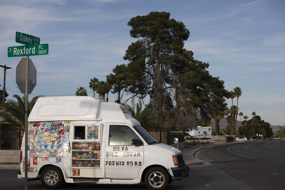 An ice cream truck drives around downtown in search of customers on Saturday, April 25, 2020, i ...