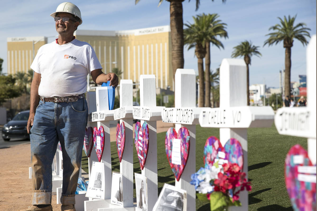 Greg Zanis, of Aurora, Ill., next to the 58 crosses he placed near the Welcome to Fabulous Las ...