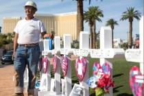Greg Zanis, of Aurora, Ill., next to the 58 crosses he placed near the Welcome to Fabulous Las ...