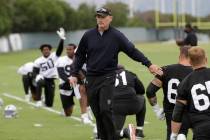Oakland Raiders general manager Mike Mayock, center, greets Richie Incognito, second from botto ...