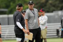 Oakland Raiders head coach Jon Gruden, left, and general manager Mike Mayock meet during the NF ...