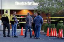 Las Vegas police investigate a homicide after a man was found dead in the parking lot of a stri ...