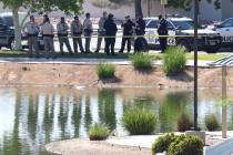 Las Vegas police investigate after a man's body was found floating in a lake at Lorenzi Park on ...