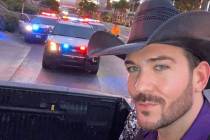 Las Vegas country artist Chase Brown takes a selfie with Metro units in the background on the S ...