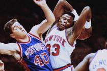 New York Knicks Patrick Ewing grabs a rebound away from Detroit Pistons Bill Laimbeer in the fi ...