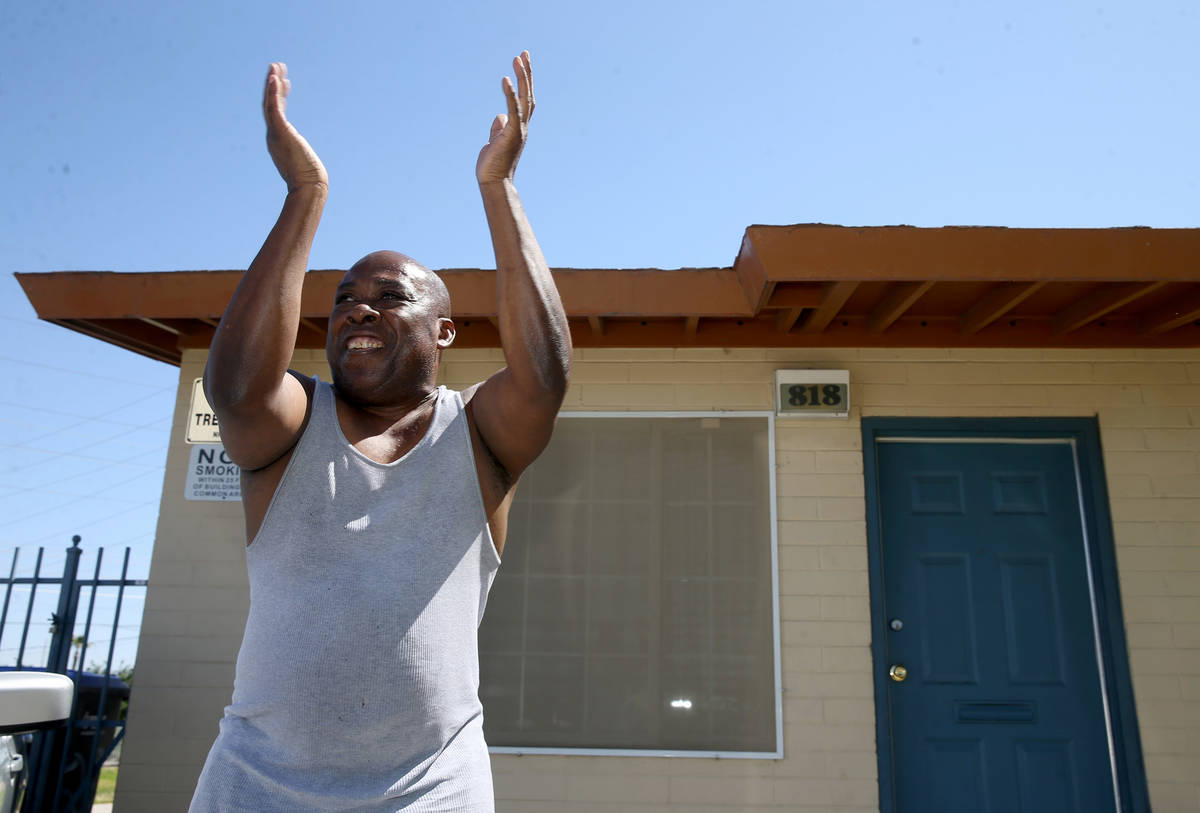 Dyarell Hunt, 63, dances outside his home as Clark County Parks and Recreation Department staff ...