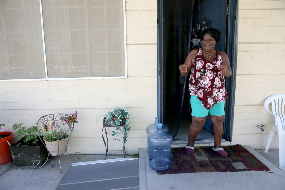 Dessia Barlow, 68, dances outside her home as Clark County Parks and Recreation Department staf ...