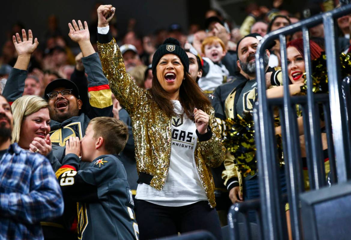 Golden Knights fans celebrate a goal by Tomas Nosek, not pictured, during the first period of a ...