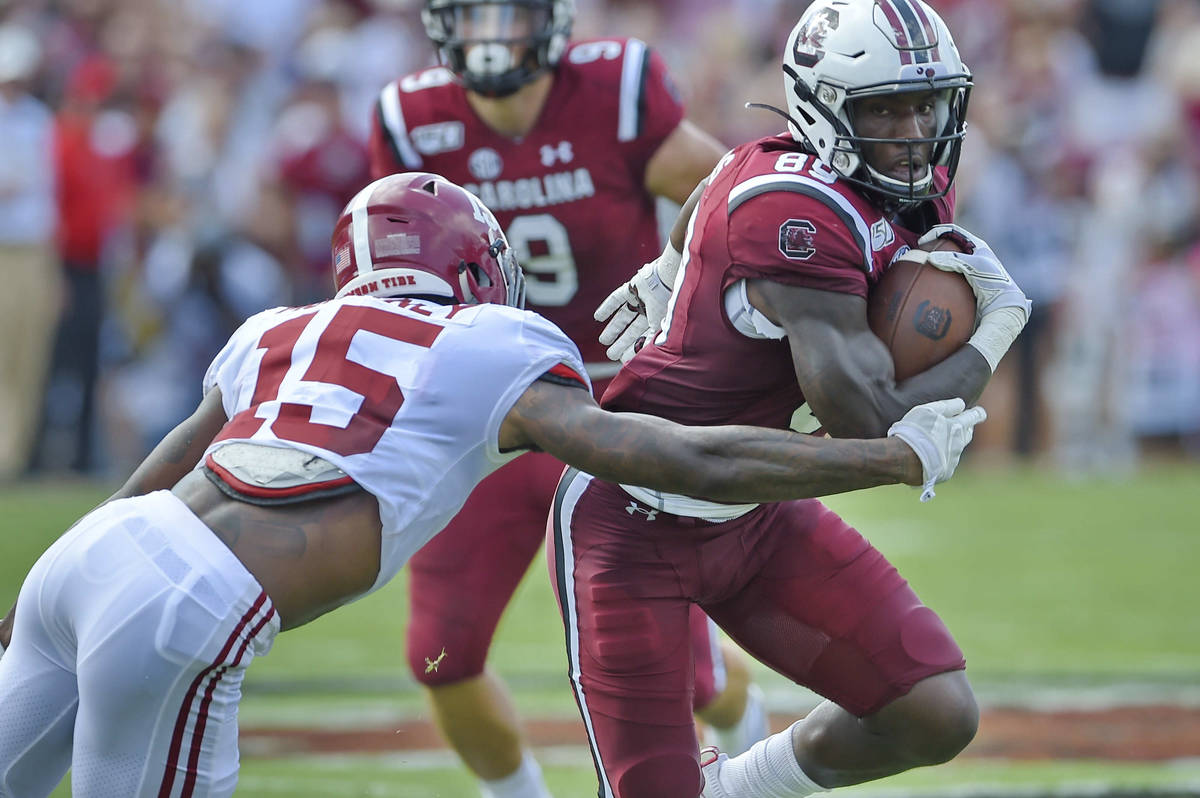 South Carolina's Bryan Edwards (89) rushes while defended by Alabama's Xavier McKinney during t ...