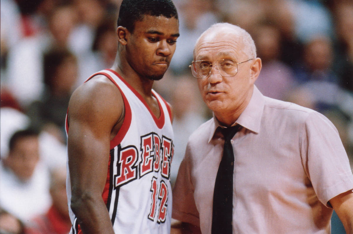 UNLV basketball player Anerson Hunt, left, stands with UNLV head coach Jerry Tarkanian during a ...