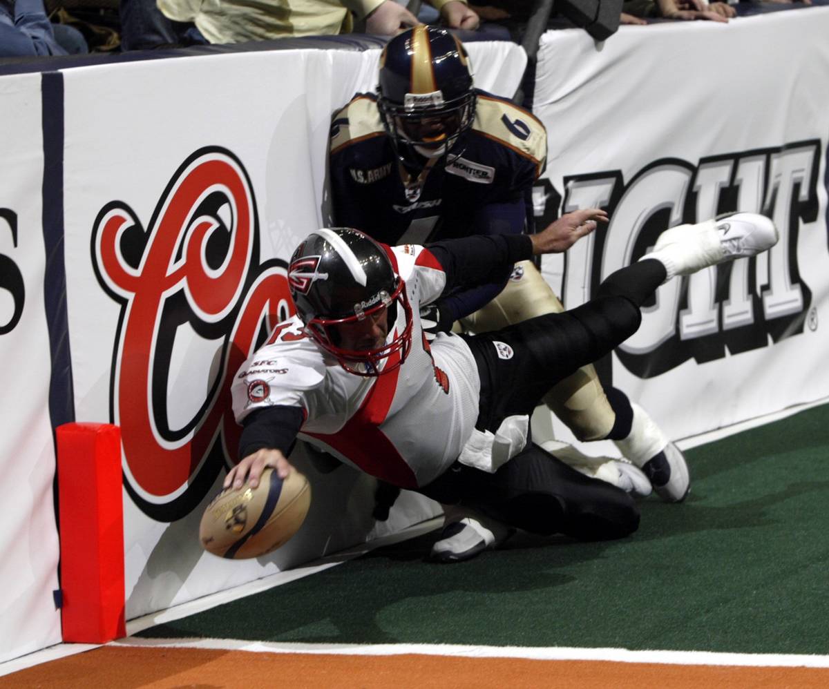 SPECIAL FOR THE LAS VEGAS REVIEW JOURNAL- Las Vegas Gladiators quarterback Clint Dolezel (13) d ...