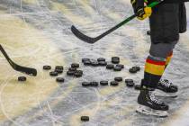 Pucks pile up on the ice as the Vegas Golden Knights warm up before the first period of their N ...