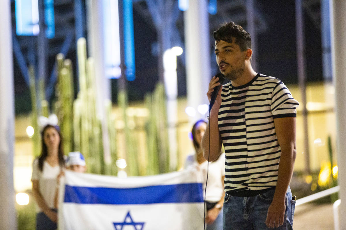 Gal Hayon sings "Hatikvah," the Israeli national anthem, as the flag of Israel is dis ...