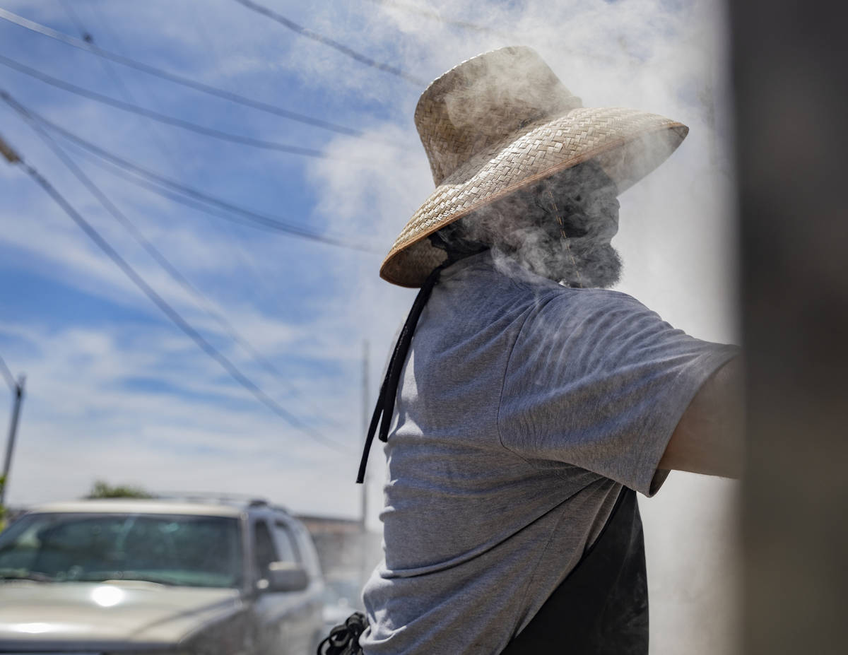 Annie's Kitchen pit master Quincy Reynolds, prepares ribs for to-go orders at the restaurant th ...