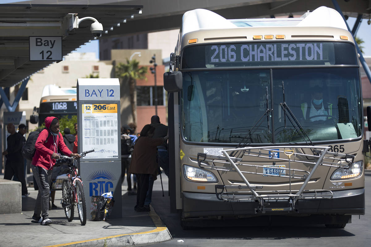 Passengers get off and on the bus at the Bonneville Transit Center in Las Vegas, Tuesday, April ...