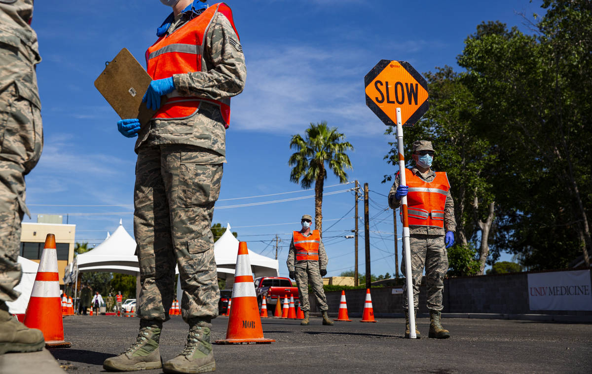 Members of the National Guard assist the UNLV School of Medicine with administering COVID-19 te ...