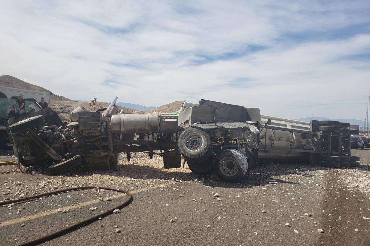 Troopers investigate a gravel truck rollover Wednesday, April 29, 2020, on southbound Interstat ...