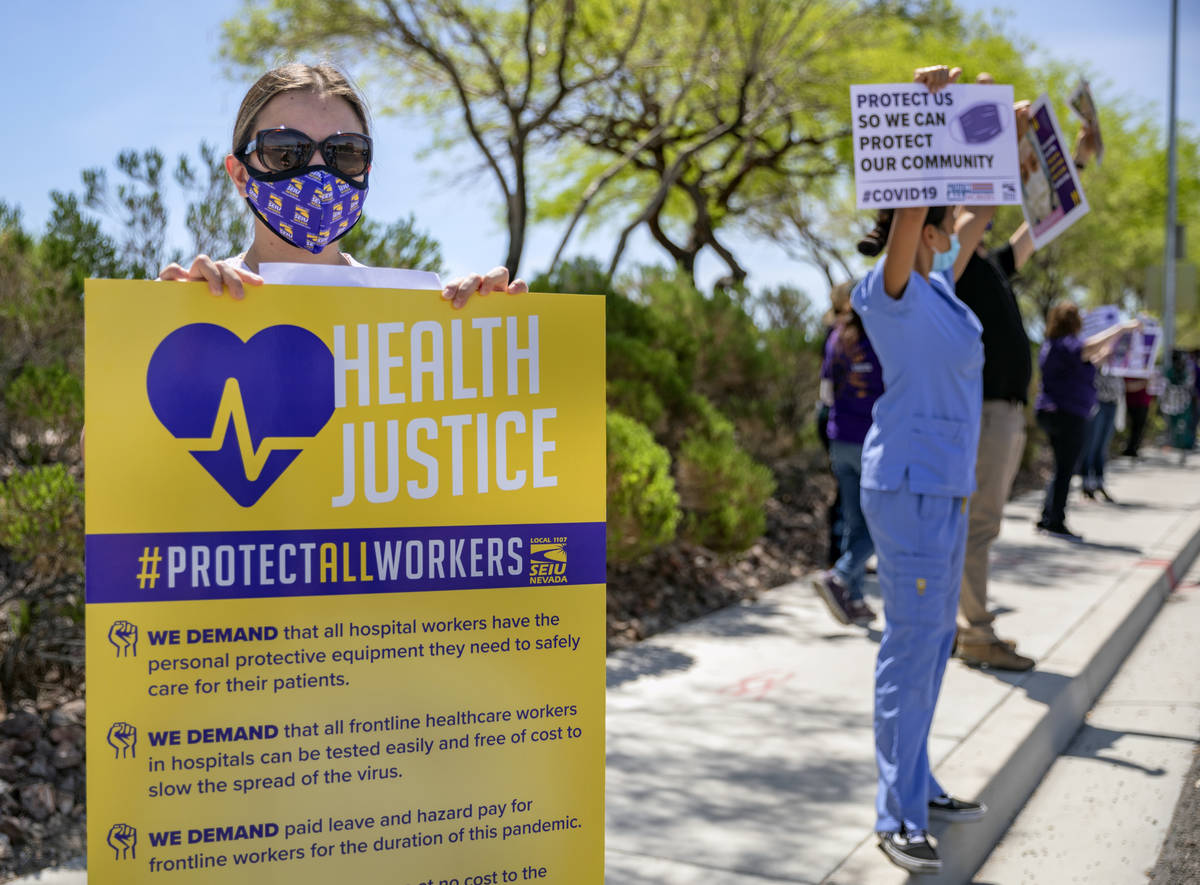 Yarleny, left, and other Local SEIU 1107 members, honor other frontline health care workers and ...