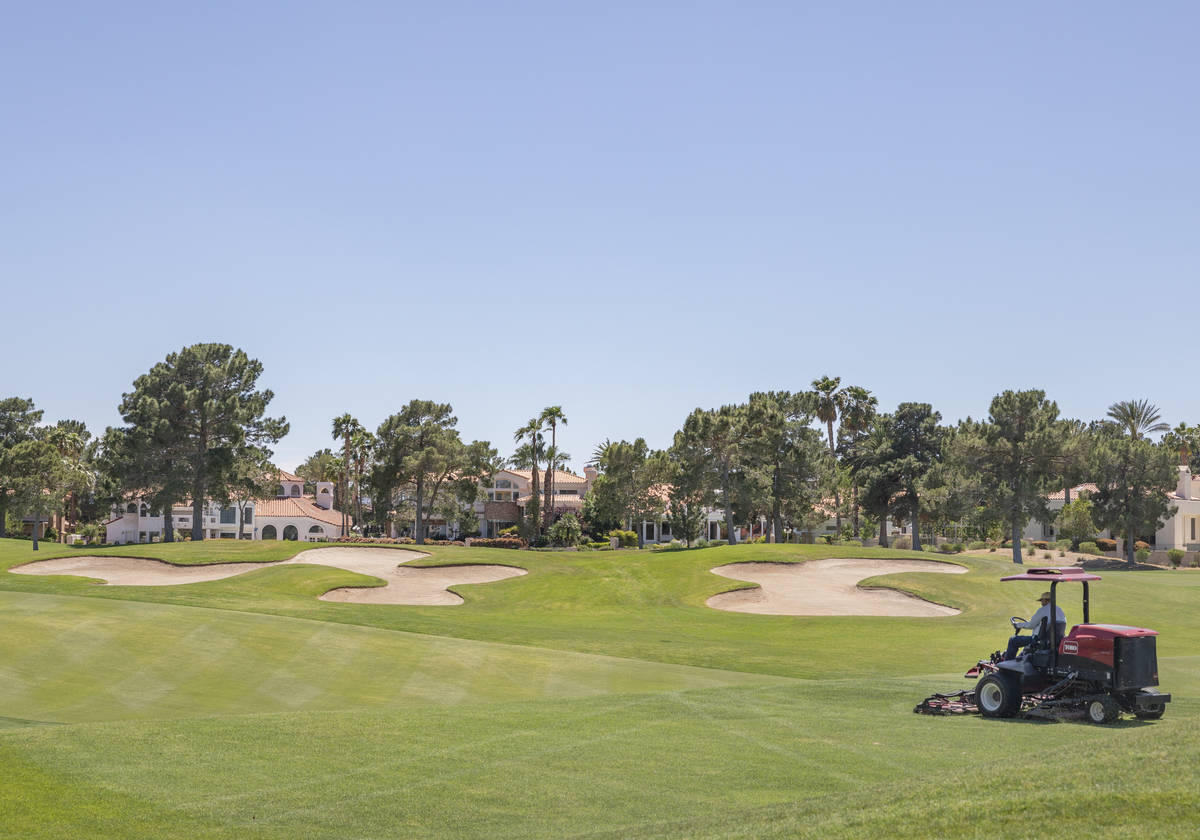 Groundskeeping is done to prepare for the opening of the Spanish Trail Country Club and Golf Co ...