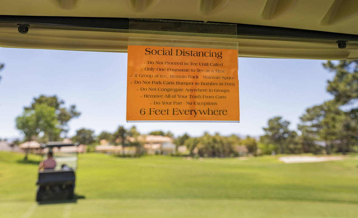Social distancing requirements are seen posted on all golf carts for the opening of the Spanish ...