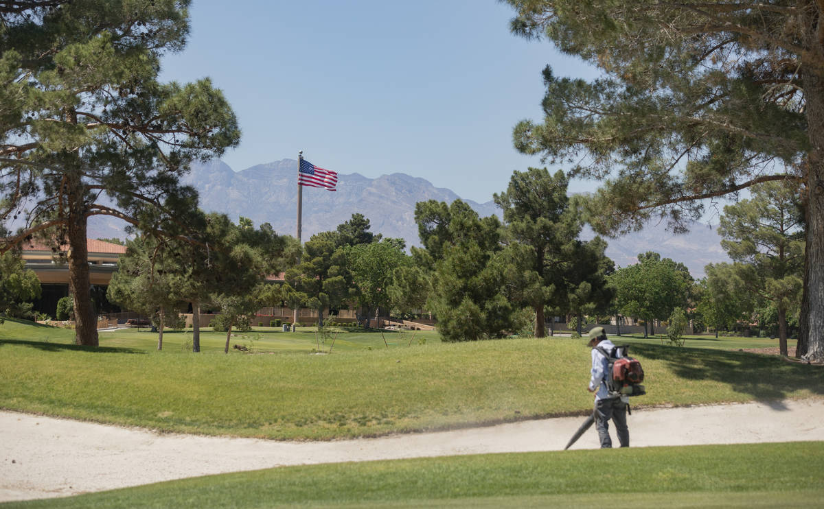 Groundskeepers prepare for the opening of the Spanish Trail Country Club and Golf Course in Las ...