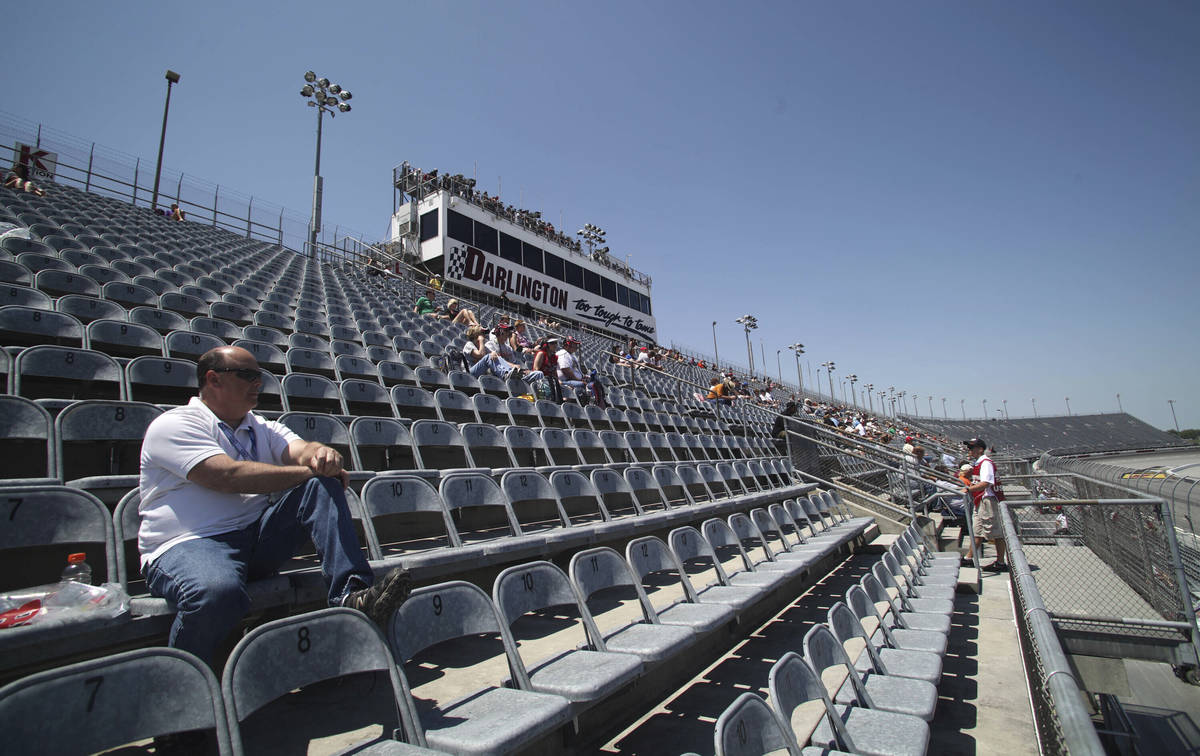 FILE - In this May 11, 2012, file photo, a few fans are shown in the grandstands to watch NASCA ...