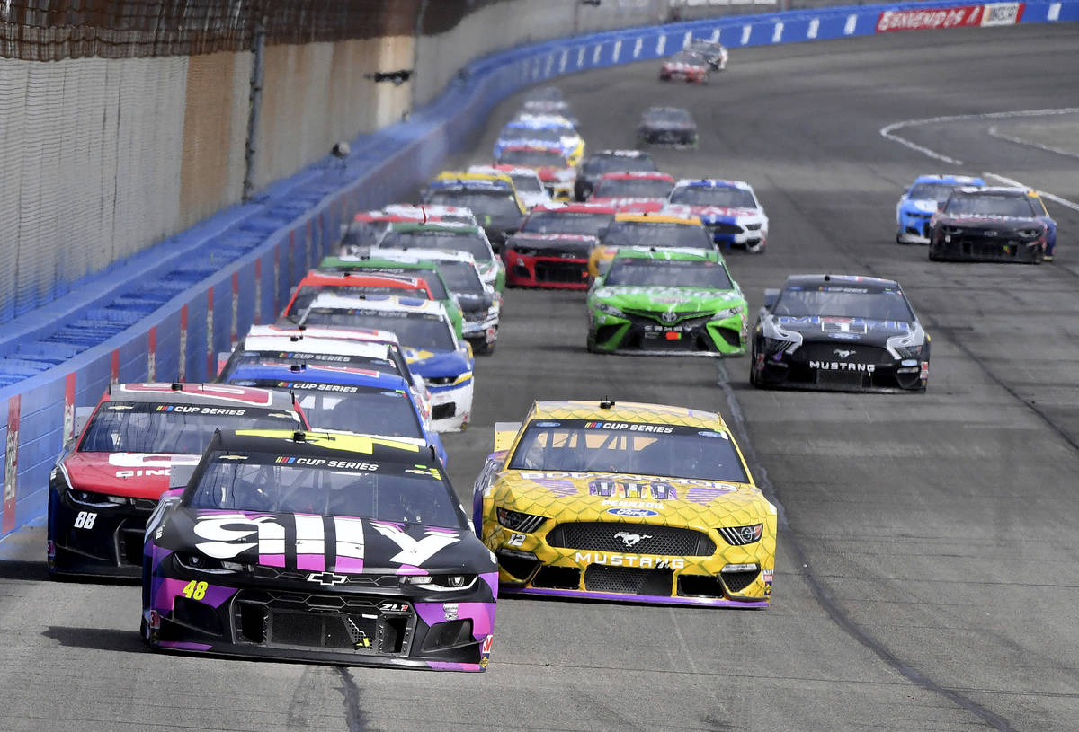 Jimmie Johnson (48) leads the field into Turn 3 during the second stage of a NASCAR Cup Series ...