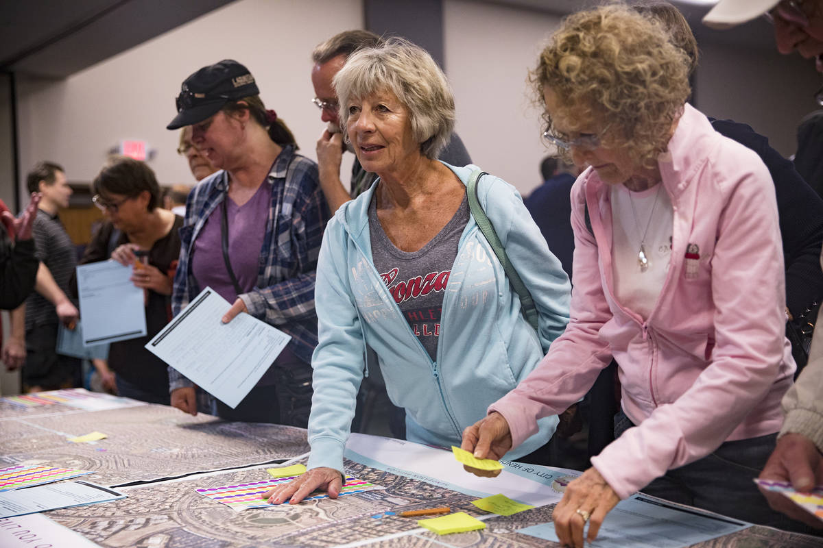 Lois Anderson speaks with city officials at a meeting the city hosted to provide information an ...