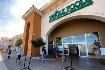 Shoppers queue up at six food distances at Whole Foods at 8855 W. Charleston Blvd. in Las Vegas ...