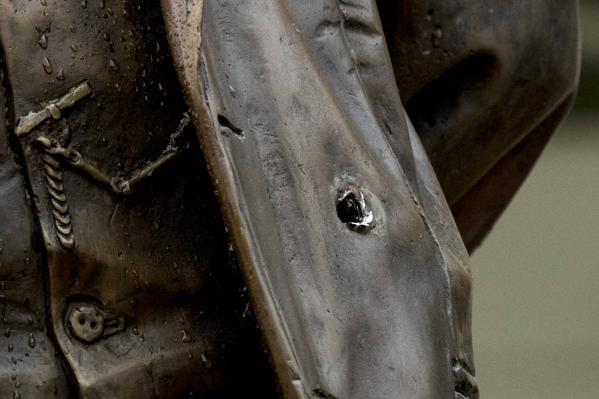 A bullet hole is visible in a statue of Cuban national hero Jose Marti after police say a perso ...