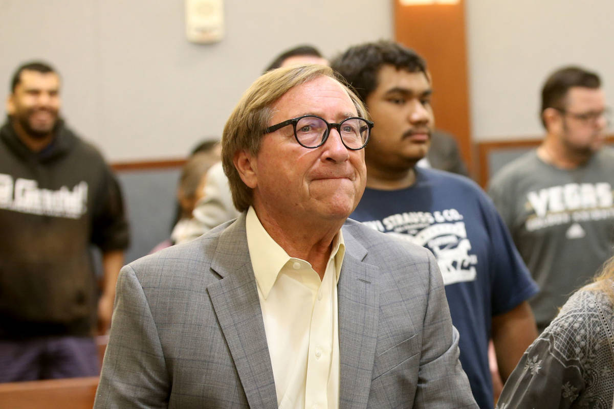 Retired Las Vegas Convention and Visitors Authority CEO Rossi Ralenkotter, left, stands as the ...