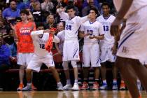 Bishop Gorman players react after one their teammates scores against Clark during the second ha ...
