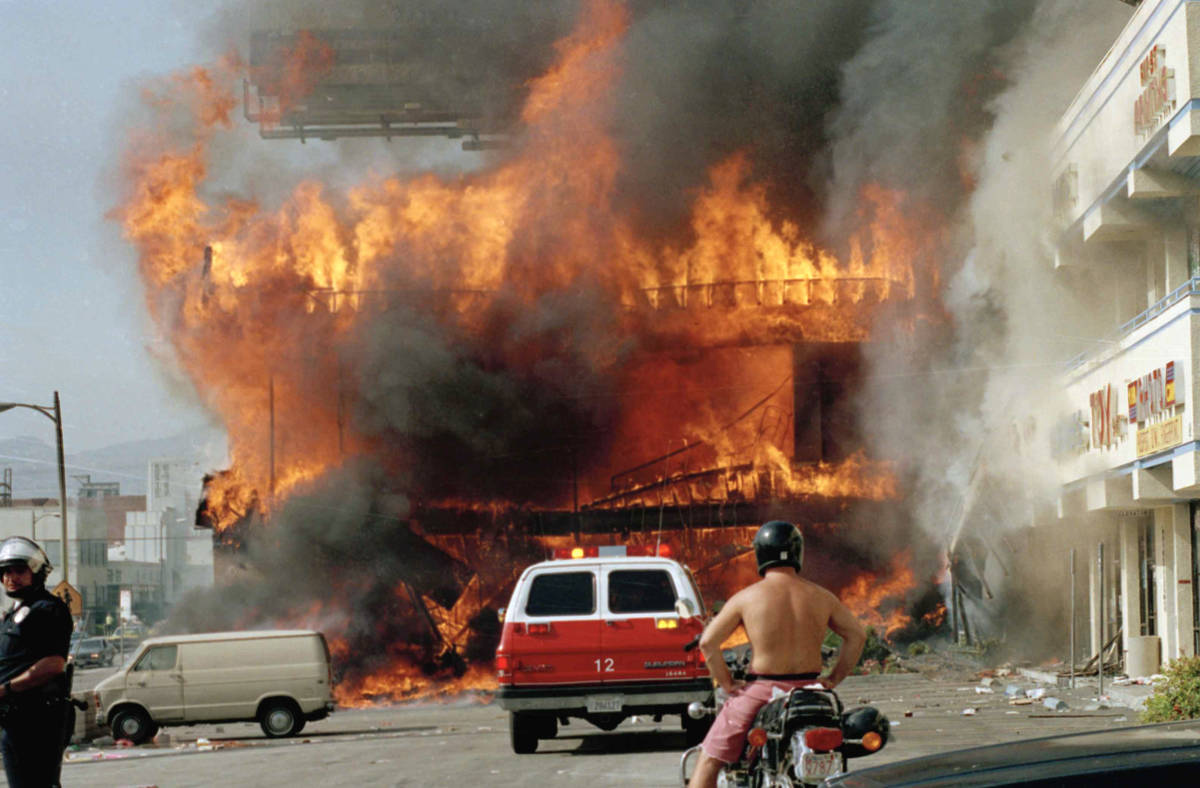 A Korean shopping mall burns at Thrid Street and Vermont Avenue in Los Angeles Thursday, April ...
