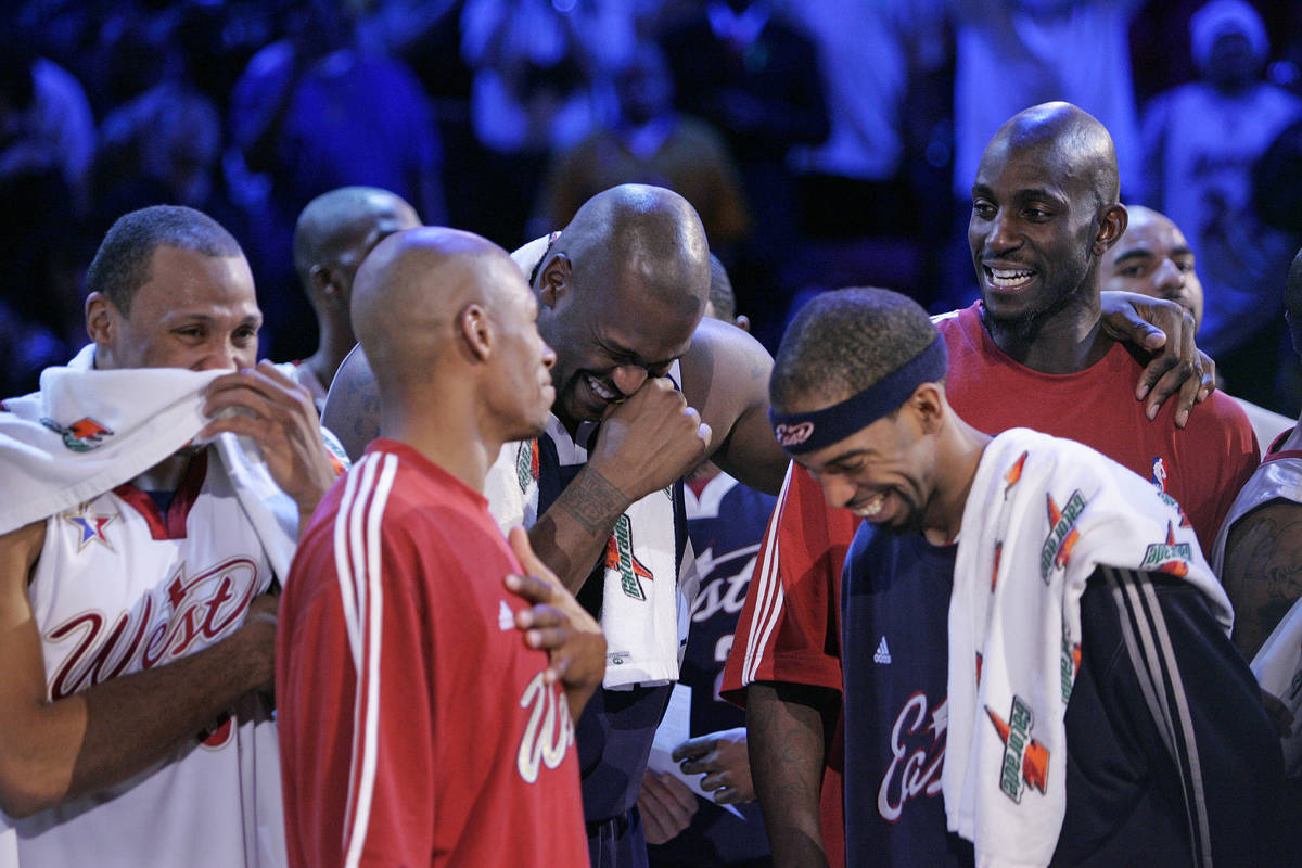 NBA Eastern Conference player Shaquille O'Neal, center, laughs with other NBA players from both ...