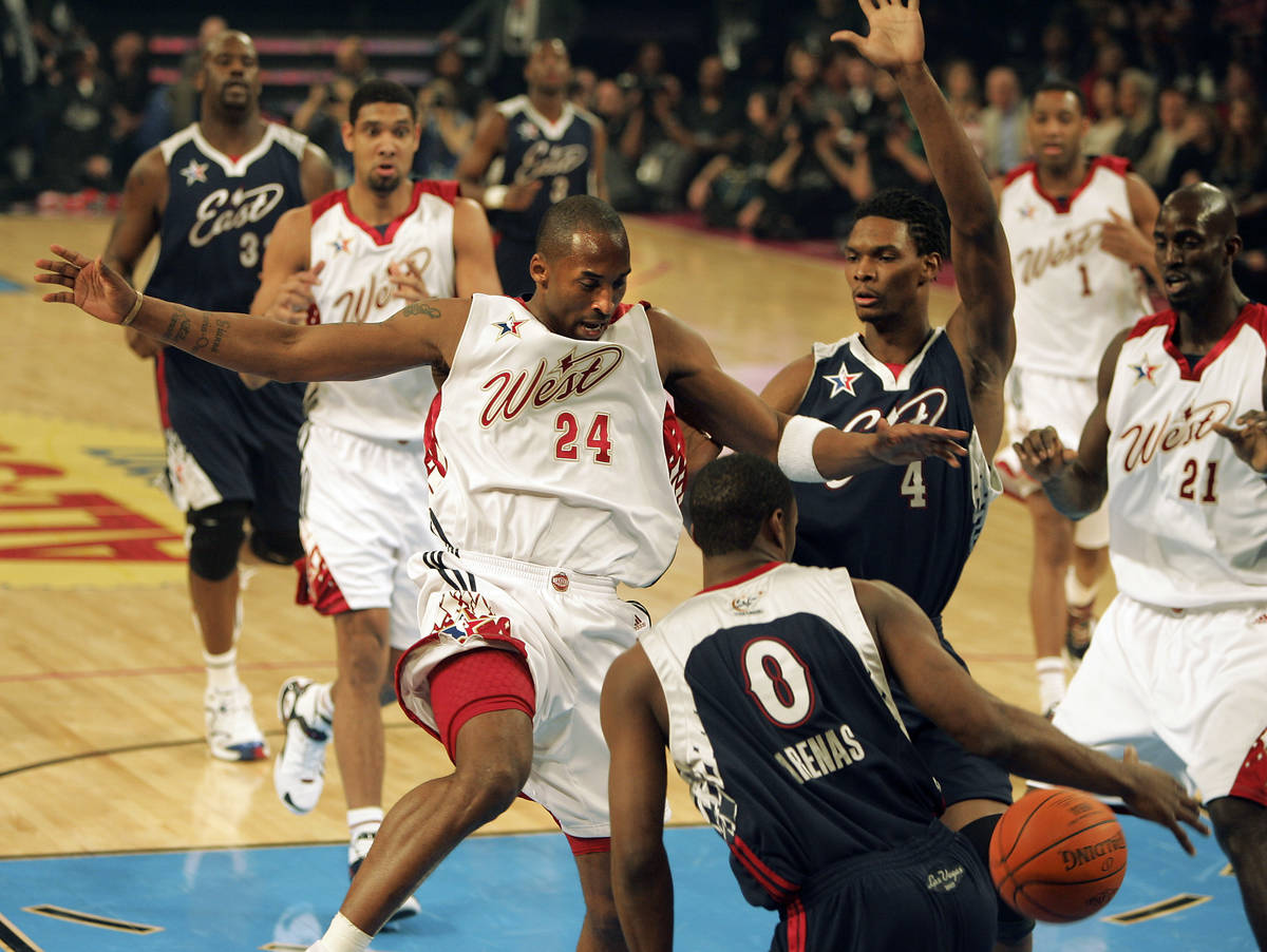 NBA Western Conference player Kobe Bryant, left, blocks NBA Eastern Conference player Gilbert A ...