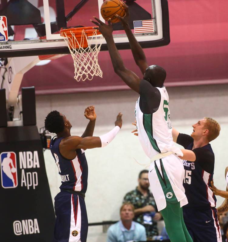 Boston Celtics' Tacko Fall (55) shoots over Denver Nuggets' Jarred Vanderbilt during a basketba ...