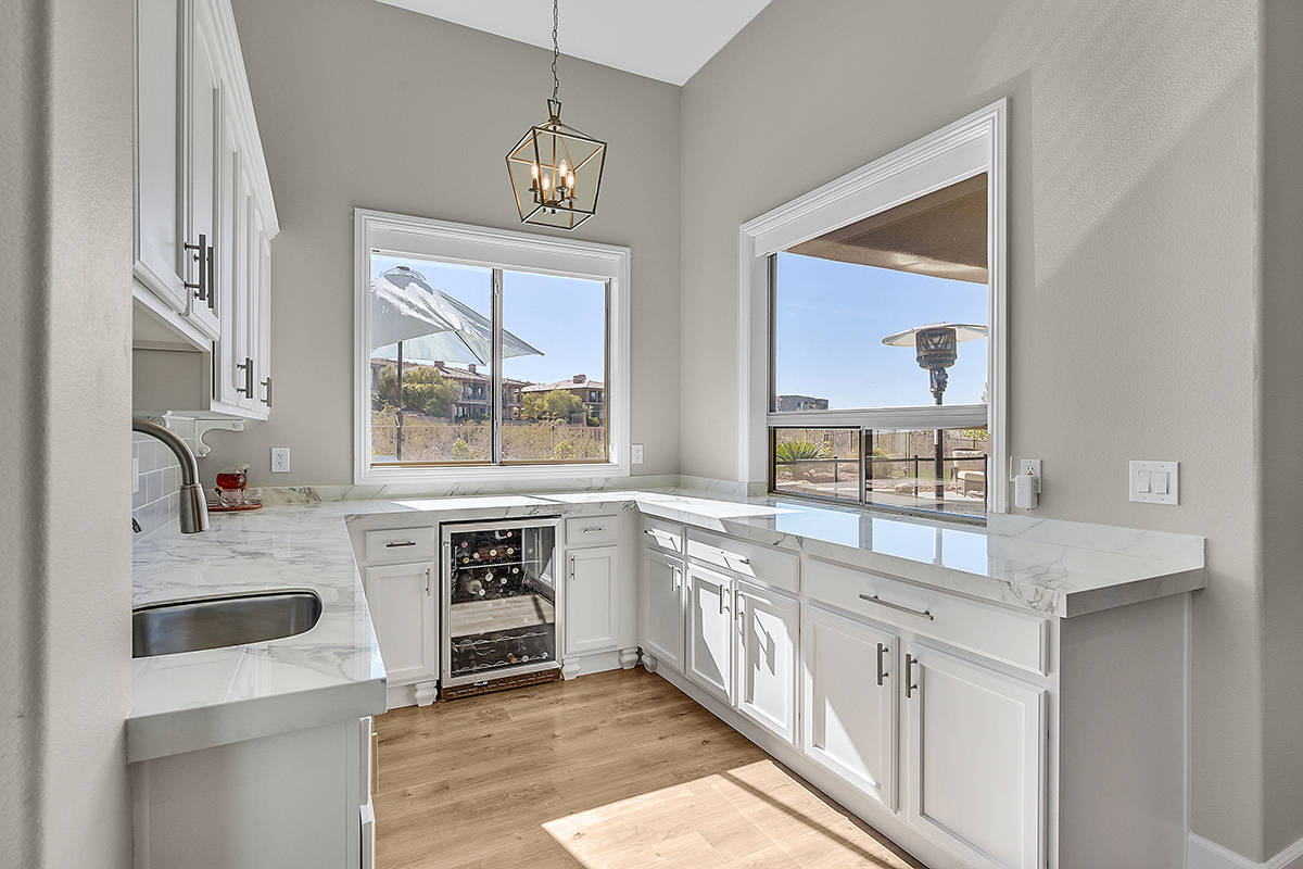 A large island resides in the center of the kitchen and features porcelain countertops. (Huntin ...