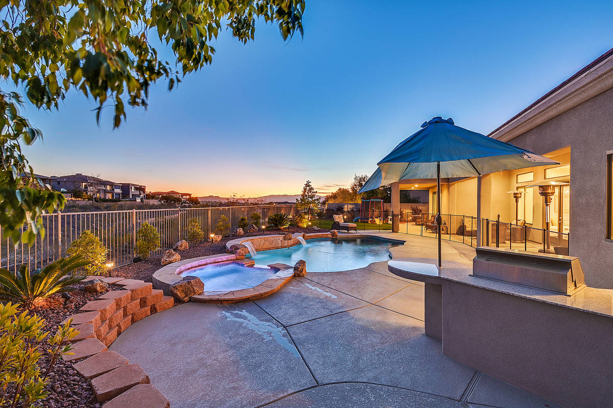 The Anthem Country Club home has a pool, spa and patio in the backyard. (Huntington & Ellis)