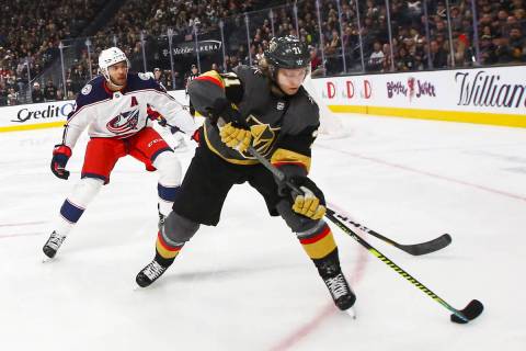 Golden Knights' William Karlsson (71) skates with the puck in front of Columbus Blue Jackets' S ...