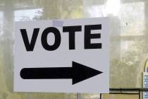 A sign points the way to the polling station. (Review-Journal File)