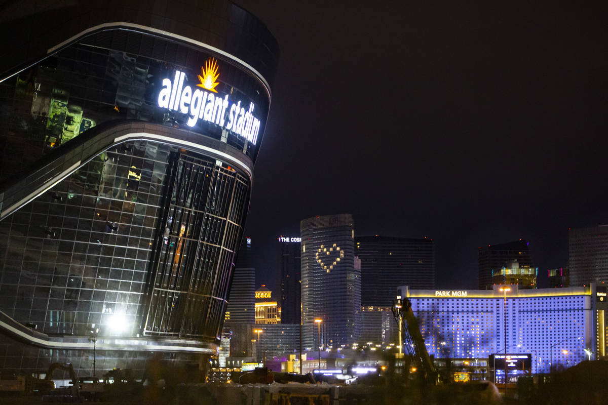 The lights for the exterior signage of Allegiant Stadium are lit as construction continues in L ...